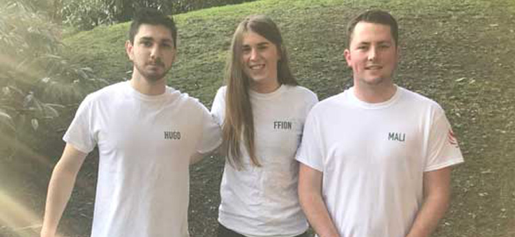 3 students standing next to each other